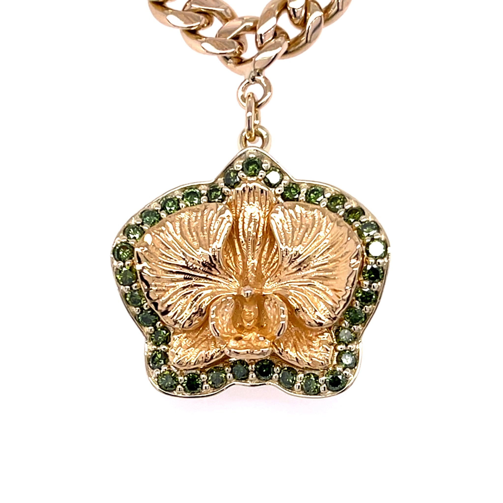 Green Diamond accented around flower pendant in yellow gold