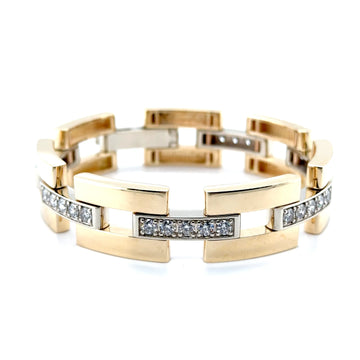 Gold bracelet with diamond accents on a white background