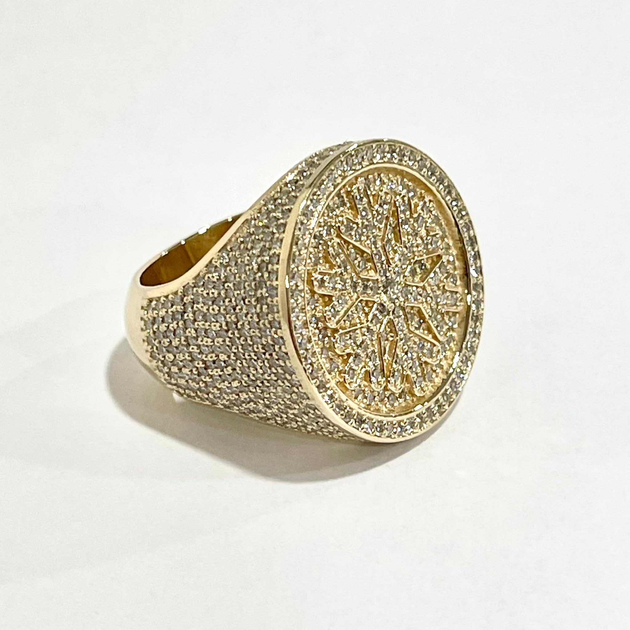Diamond ring with snowflake design in the center 