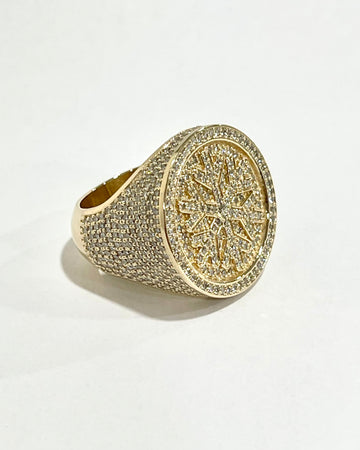 Diamond ring with snowflake design in the center 