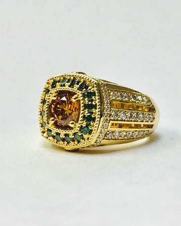 Gold ring with gemstones on a white background