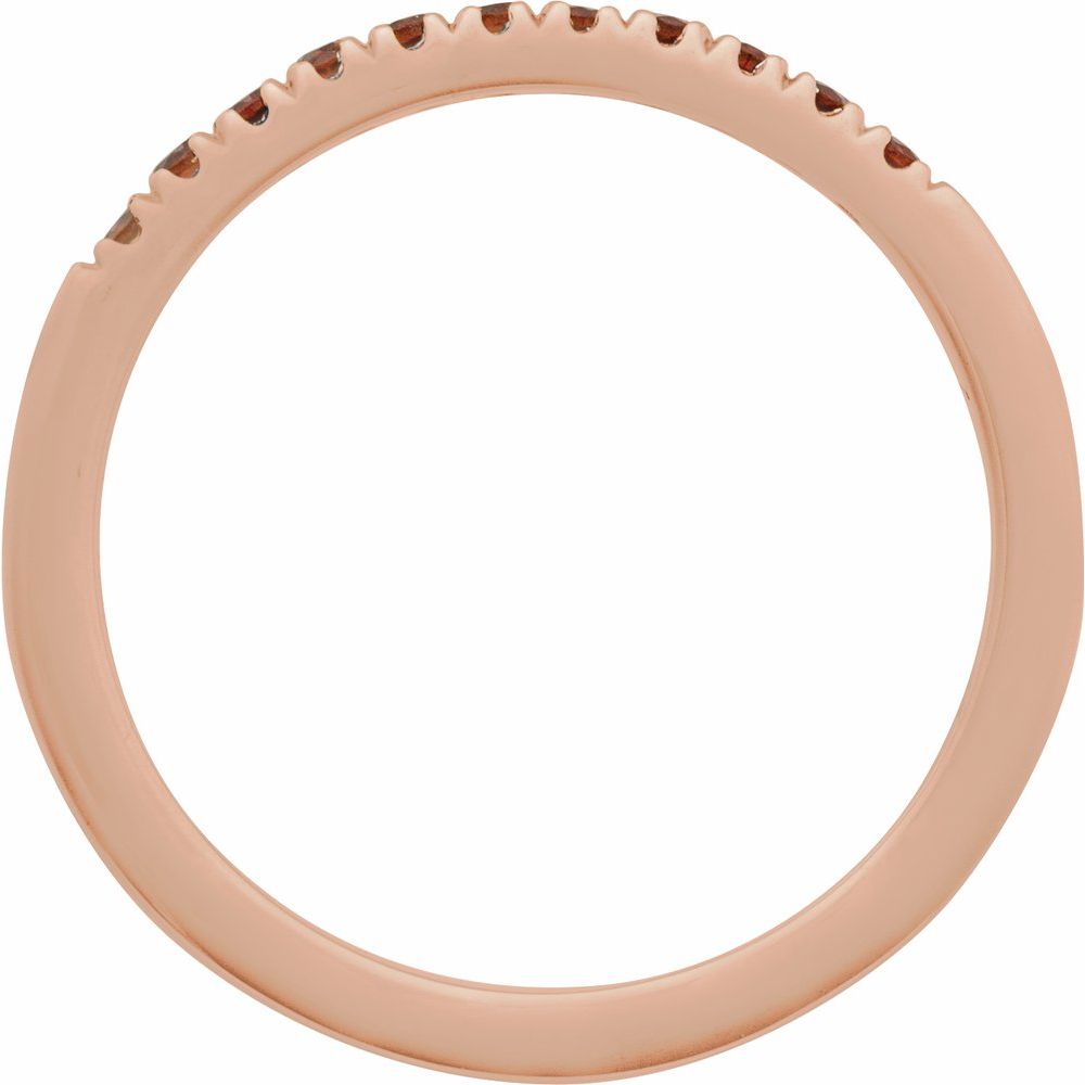 Rose gold ring with small stones on a white background
