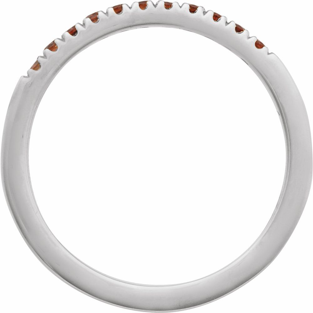 Silver ring with small brown stones on a white background