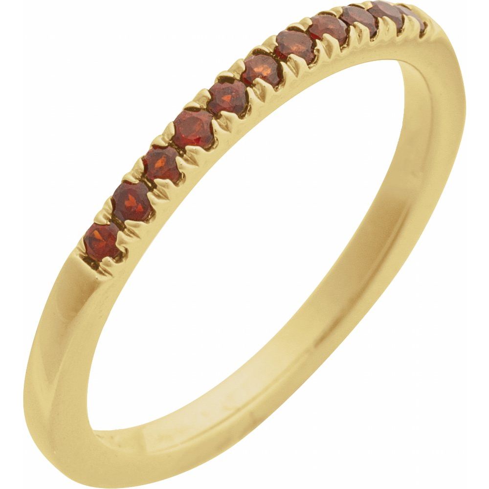 Gold ring with red gemstones on a light gray background, labeled 'January Garnet'.
