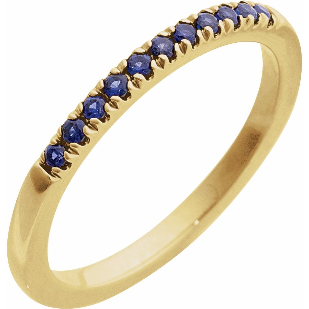 Gold ring with blue gemstones on a light gray background, labeled 'September Sapphire'.