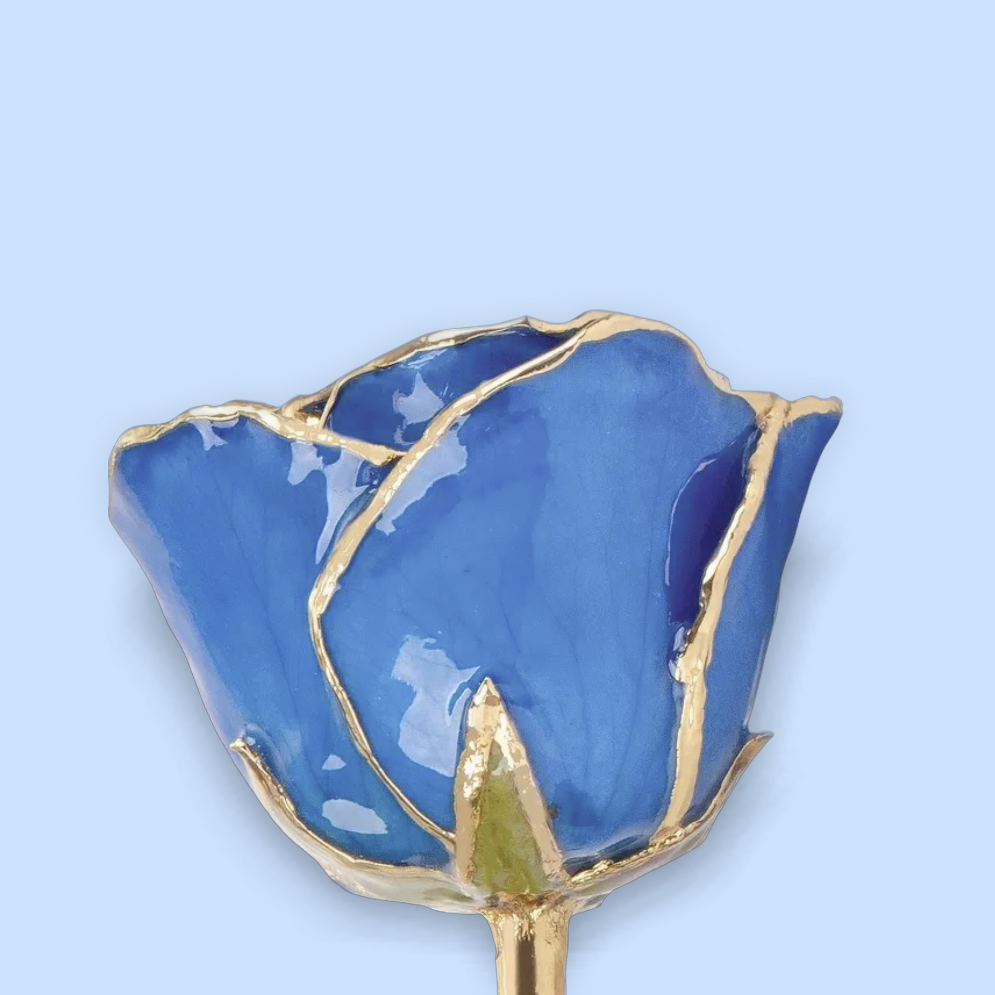 Blue rose-shaped object with gold accents on a light blue background